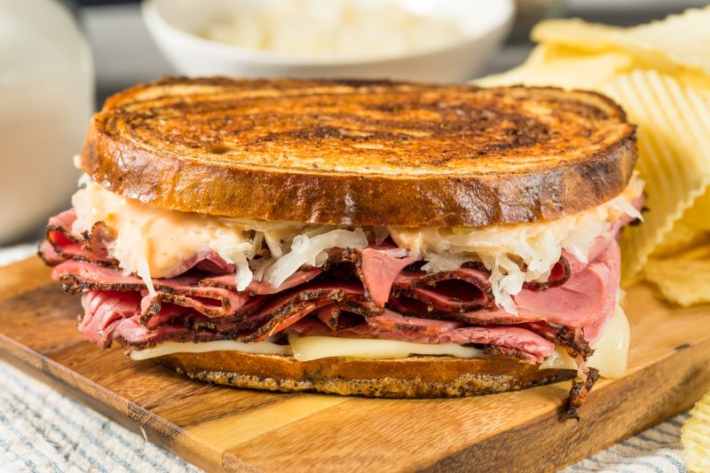 Homemade Russian Reuben Sandwich with Cheese and Chips